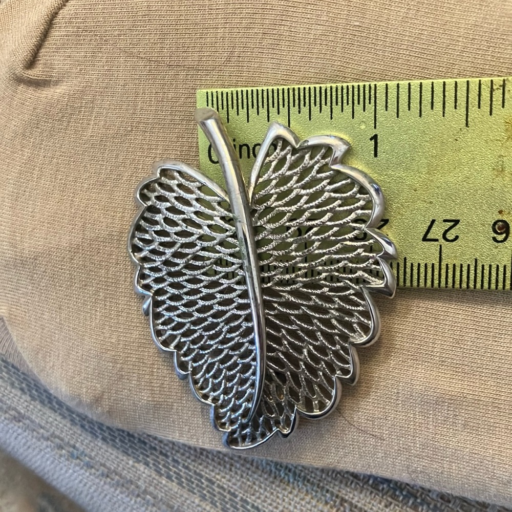 Open work brooch
